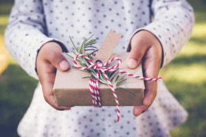 girl holding wrapped gift