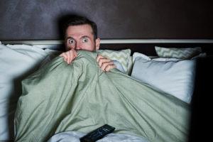 Man Scared Under Blanket